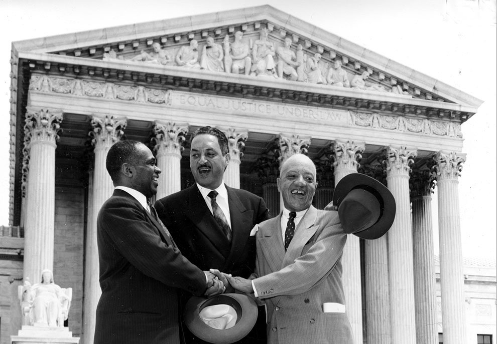 George E. C. Hayes, Thurgood Marshall, and James M. Nabrit (right to left) pose outside the U. S. Supreme Court in Washington, D.C., May 17, 1954 after their victory in a landmark, Brown v. Topeka Board of Education.